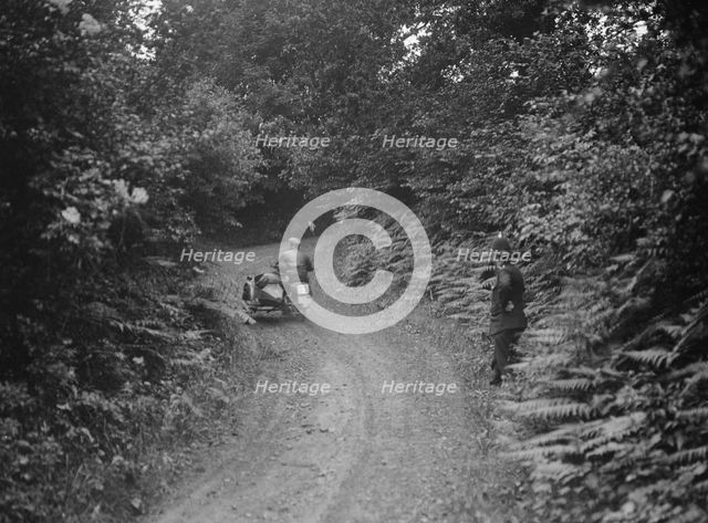 Motorcycle and sidecar, B&HMC Brighton-Beer Trial, Simms Hill, Ilsington, Devon, 1930. Artist: Bill Brunell.