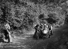 Motorcycle and sidecar competing in the Brighton and Hove Motor Club Brighton-Beer Trial, 1930. Artist: Bill Brunell
