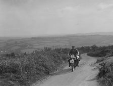 Motorcycle competing in the MCC Torquay Rally, 1938. Artist: Bill Brunell