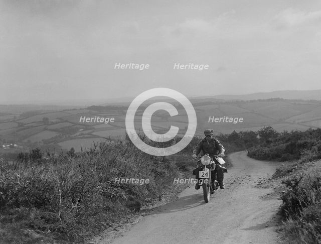 Motorcycle competing in the MCC Torquay Rally, 1938. Artist: Bill Brunell.