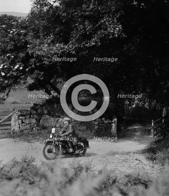 Motorcycle of WT Taylor, Brighton and Hove Motor Club Brighton-Beer Trial, 1930. Artist: Bill Brunell.
