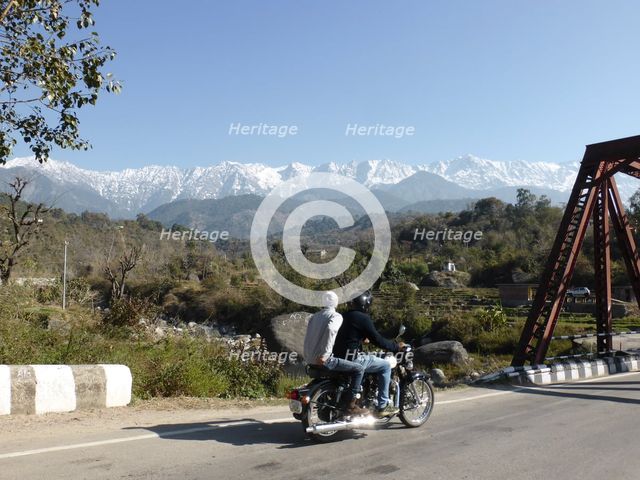 Motorcycle on road near Dhauladar Mountains Himachal Pradesh. Creator: Unknown.