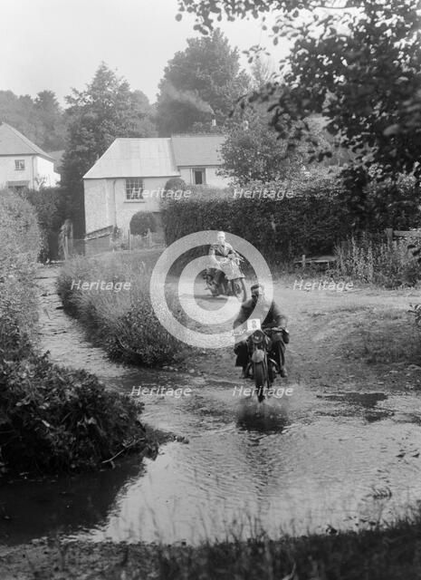 Motorcycles competing in the B&HMC Brighton-Beer Trial, Windout Lane, near Dunsford, Devon, 1934. Artist: Bill Brunell.