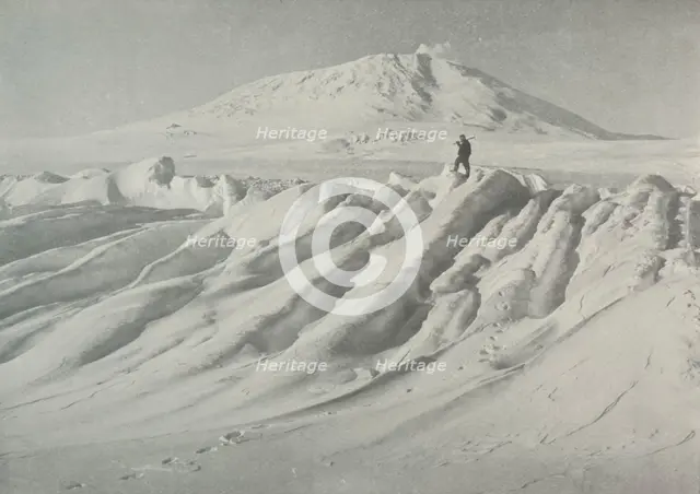 'Mount Erebus Over a Water-Worn Iceberg', October 1911, (1913). Artist: Herbert Ponting.