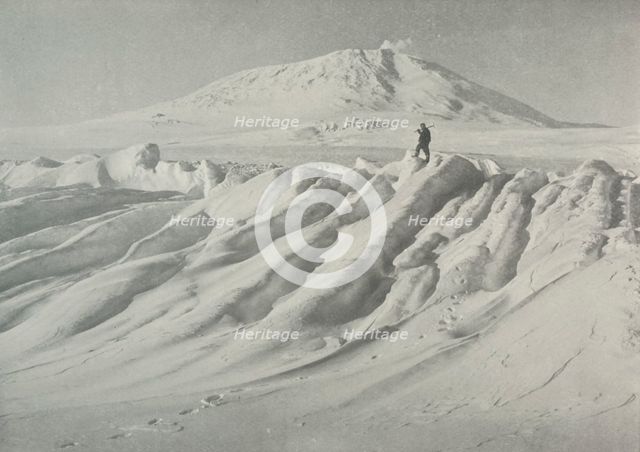 'Mount Erebus Over a Water-Worn Iceberg', October 1911, (1913). Artist: Herbert Ponting.