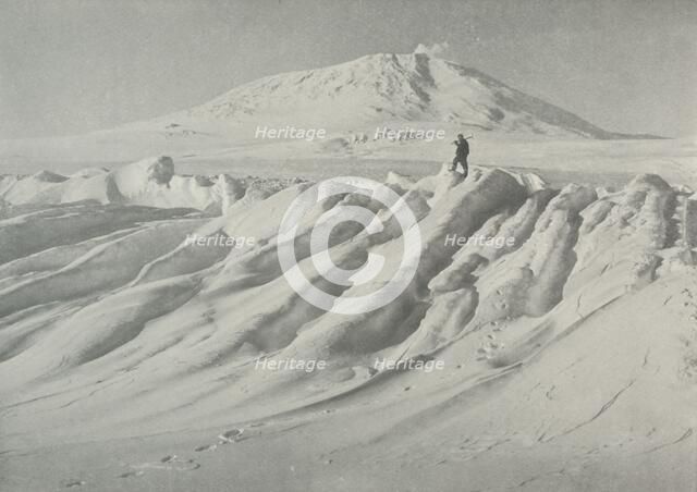 'Mount Erebus Over a Water-Worn Iceberg', October 1911, (1913). Artist: Herbert Ponting.