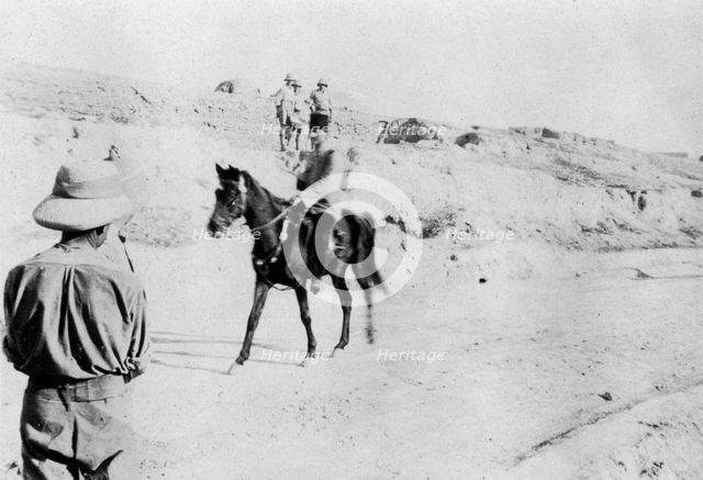 Mounted Turkish officer leaving Mosul, Mesopotamia, WWI, 1918. Artist: Unknown