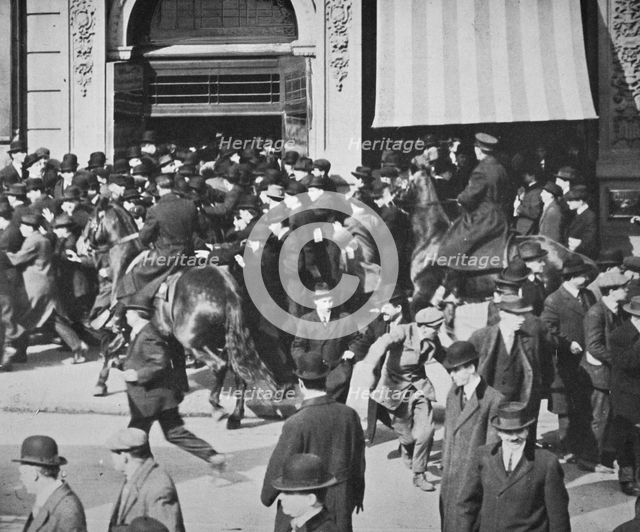 Mounted police disperse a crowd, Union Square, New York City, USA, late 19th or early 20th century. Creator: Unknown.