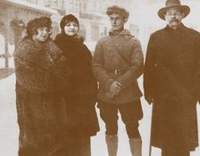 Moura Budberg (second from left) with Maxim Gorky (right), c. 1920. Artist: Anonymous