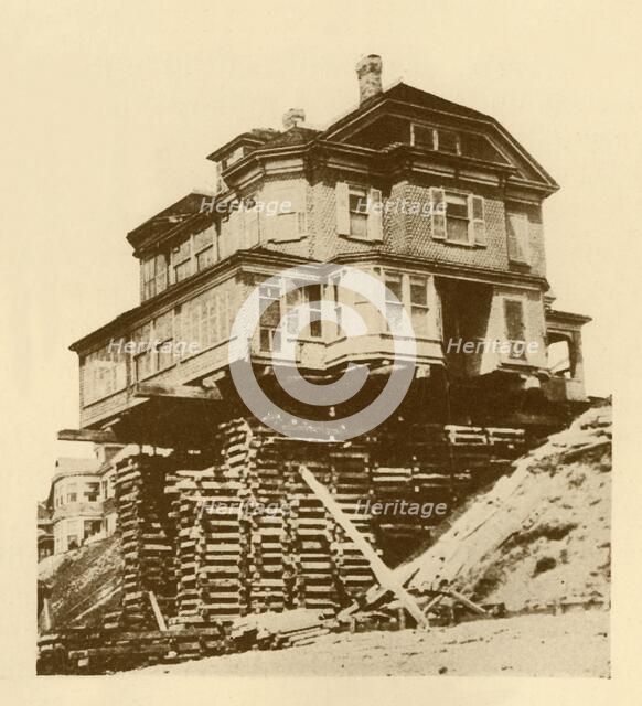 'Moving a House Bodily', c1930. Creator: Unknown.