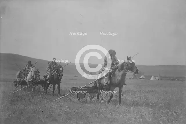 Moving camp-Atsina, c1908. Creator: Edward Sheriff Curtis.