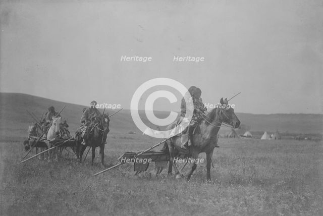 Moving camp-Atsina, c1908. Creator: Edward Sheriff Curtis.