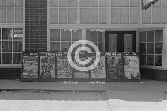 Movie posters, vicinity of Moundsville, Alabama, 1936. Creator: Walker Evans.