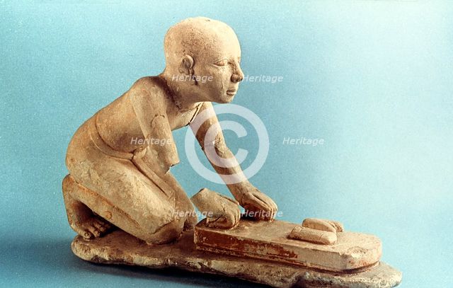 Model of a baker kneading dough and forming loaves, Ancient Egyptian. Artist: Unknown
