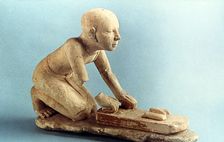 Model of a baker kneading dough and forming loaves, Ancient Egyptian