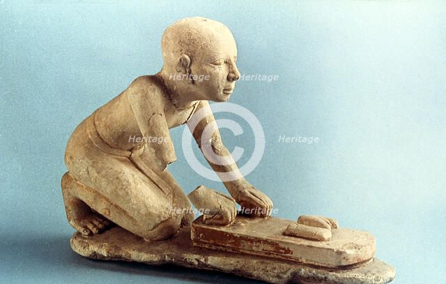 Model of a baker kneading dough and forming loaves, Ancient Egyptian. Artist: Unknown