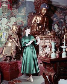 Model showing an evening dress in oriental style, 1950s. Artist: Göran Algård