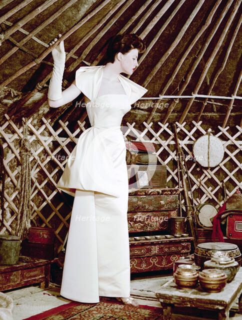 Model showing an evening dress in oriental style, 1950s.  Artist: Göran Algård