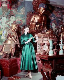 Model showing an evening dress in oriental style, 1950s. Creator: Göran Algård