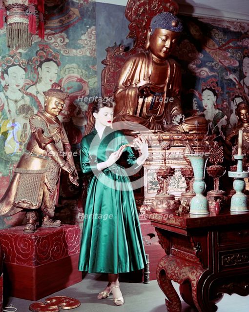 Model showing an evening dress in oriental style, 1950s.  Creator: Göran Algård.