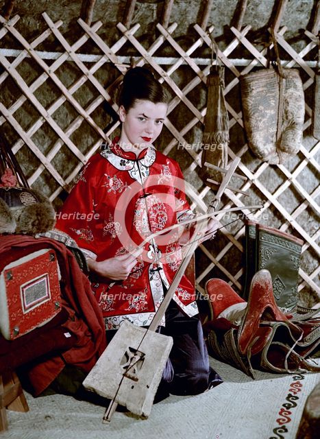Model showing an evening jacket in oriental style, 1950s.  Creator: Göran Algård.