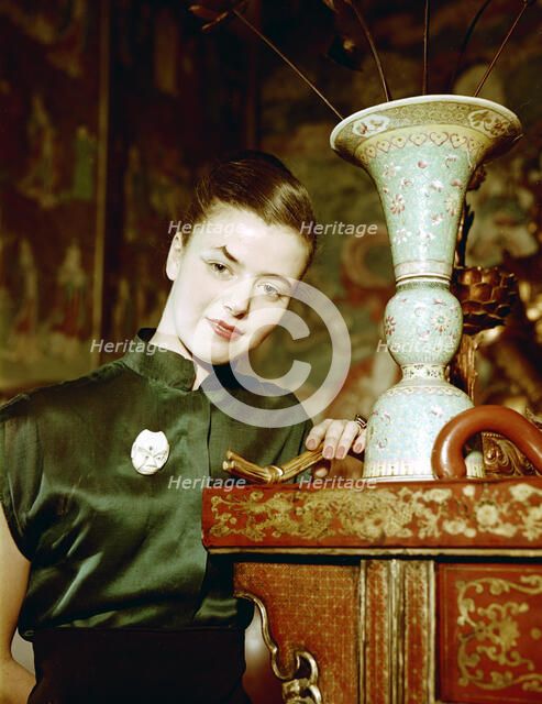 Model wearing an evening dress in oriental style, 1950s.  Artist: Göran Algård