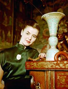 Model wearing an evening dress in oriental style, 1950s. Creator: Göran Algård