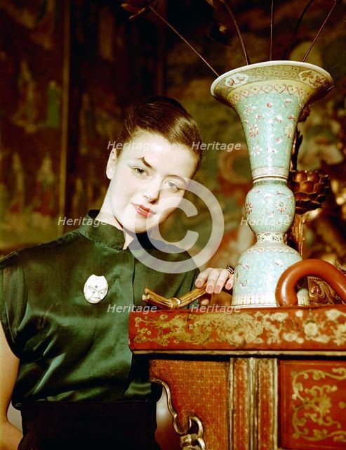 Model wearing an evening dress in oriental style, 1950s.  Creator: Göran Algård.
