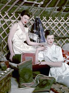 Models showing nightdresses in oriental style, 1950s. Creator: Göran Algård