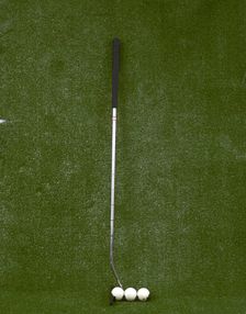 Modern-style golf club and three balls, late 20th century. Creator: Unknown