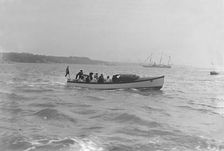 Modwena's motor launch with Modwena in the background, 1911. Creator: Kirk & Sons of Cowes
