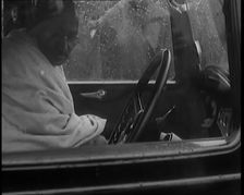 Mohandas K Gandhi (Mahatma) Sitting in a Car in the Rain, 1931. Creator: British Pathe Ltd