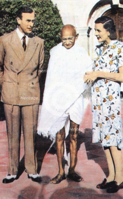 Mohondas Karamchand Gandhi (1869-1948), standing between Lord and Lady Mountbatten. Artist: Unknown