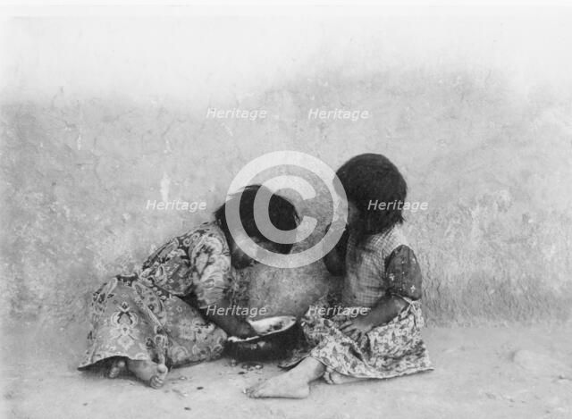 Moki melon eaters, c1900. Creator: Edward Sheriff Curtis.