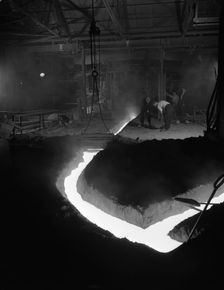 Molten steel being channelled at the Stanton Steel Works, Ilkeston, Derbyshire, 1962. Artist: Michael Walters