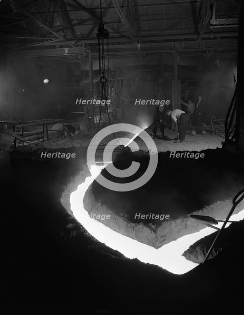 Molten steel being channelled at the Stanton Steel Works, Ilkeston, Derbyshire, 1962.  Artist: Michael Walters
