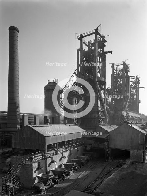 Molten steel being poured into rail trucks at the Stanton Steelworks, Ilkeston, Derbyshire, 1962. Artist: Michael Walters