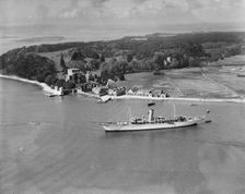 Montague Grahame-White's steam yacht Alacrity and Brownsea Island, Dorset, from the east, 1933. Artist: Aerofilms