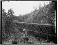 Montreal River, bridge at rock cut, Wisconsin, between 1880 and 1899. Creator: Unknown