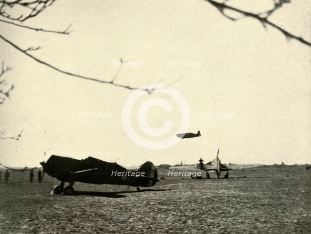 'Morane 406 at Vassincourt Aerodrome with French Curtiss Hawk and  Hurricane', 1939-1940, (1941). Creator: Unknown.
