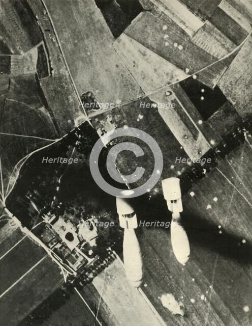 'More British Bombs on an Enemy-Held Aerodrome', 1939-1940, (1941). Creator: Unknown.