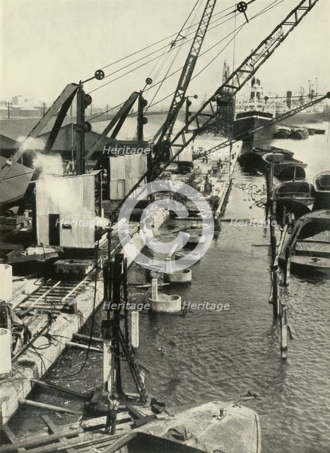 "More New Quays (The Royal Albert Docks Will Obtain a Stretch Almost a Mile Long)"', 1937. Creator: Fox.