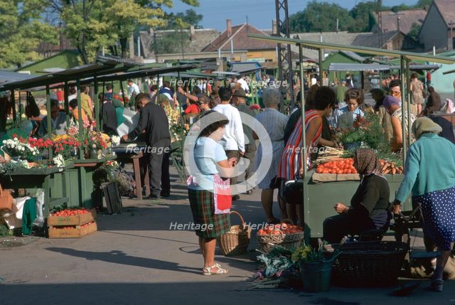 Morning market in a town in Hungary. Artist: CM Dixon Artist: Unknown