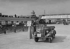 Morris 8 tourer competing in the JCC Rally, Brooklands, Surrey, 1939. Artist: Bill Brunell