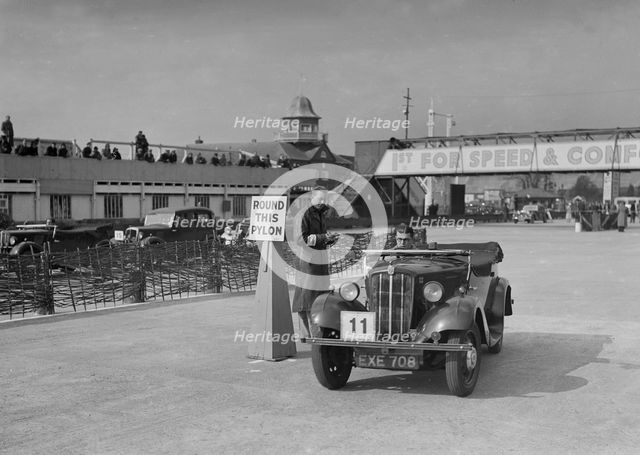 Morris 8 tourer competing in the JCC Rally, Brooklands, Surrey, 1939. Artist: Bill Brunell.