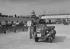Morris 8 tourer competing in the JCC Rally, Brooklands, Surrey, 1939. Artist: Bill Brunell