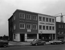 Morris Minor and a Triumph Herald outside the Royal Insurance Building, Rotherham, S Yorks, 1962. Creator: Michael Walters