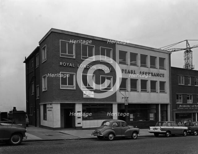 Morris Minor and a Triumph Herald outside the Royal Insurance Building, Rotherham, S Yorks, 1962. Artist: Michael Walters