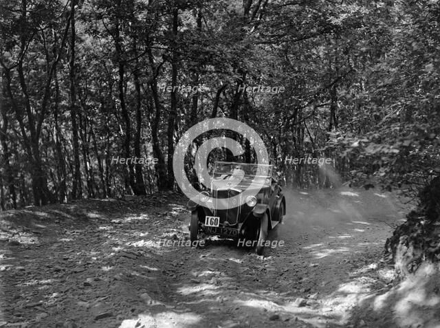Morris Minor competing in the B&HMC Brighton-Beer Trial, Fingle Bridge Hill, Devon, 1934. Artist: Bill Brunell.
