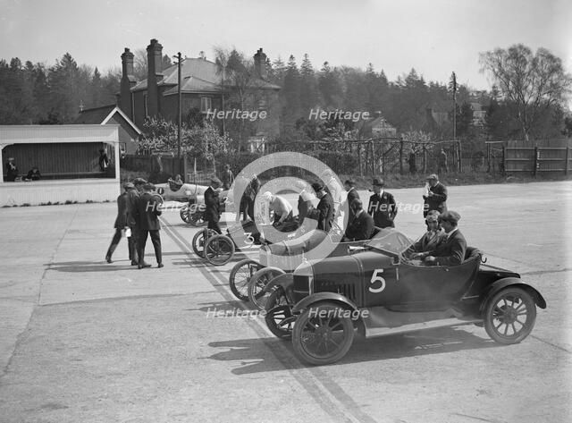 Morris, Morgan and Crouch cars on the start line of a motor race, Brooklands, 1914. Artist: Bill Brunell.